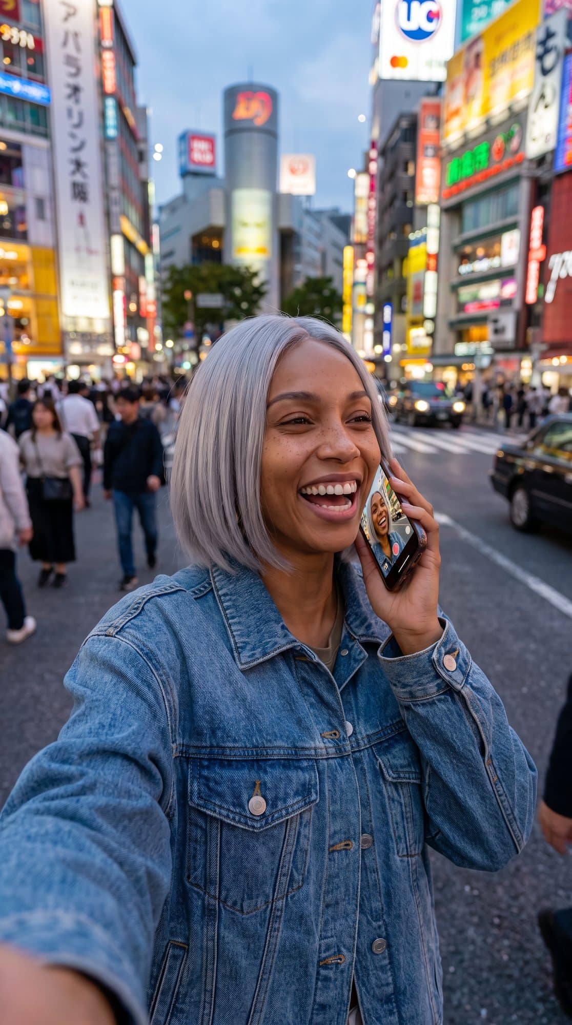 Nova filming a selfie vlog on a busy street at dusk